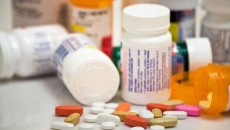 Pill bottles and pills on a table