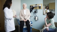 Senior patient with doctor