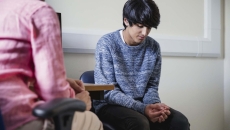 Two seated people meeting