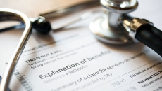 Stethoscope on Explination of Benefits document