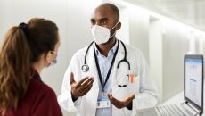 Doctor conferring with patient