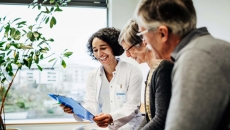 Smiling healthcare professional and couple