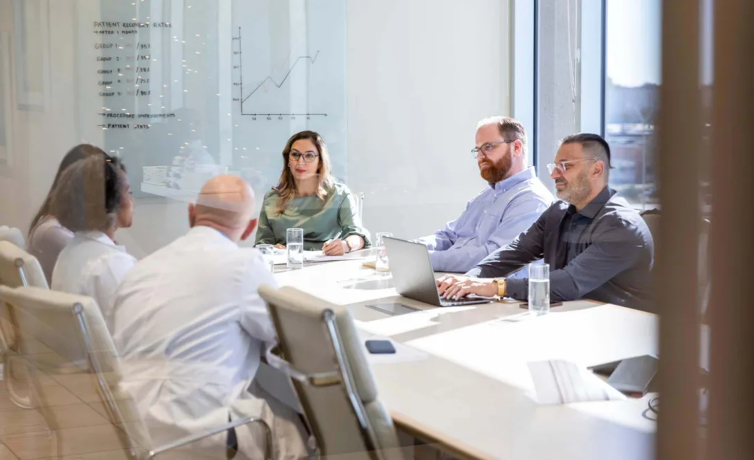Executives around a table Executives around a table