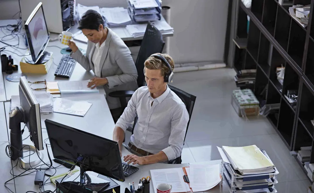 Workers at a desk Workers at a desk
