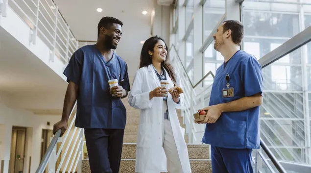 Hospital professionals on a staircase Hospital professionals on a staircase