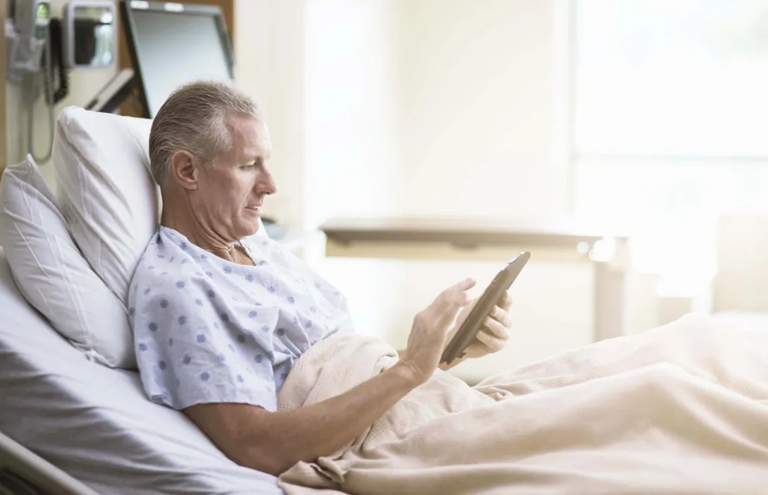 Patient in bed reading