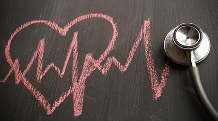 heart beat on chalkboard with steth