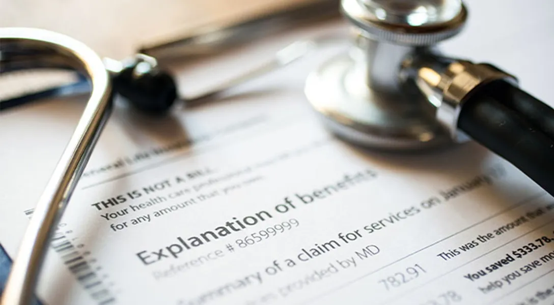 Stethoscope on Explination of Benefits document