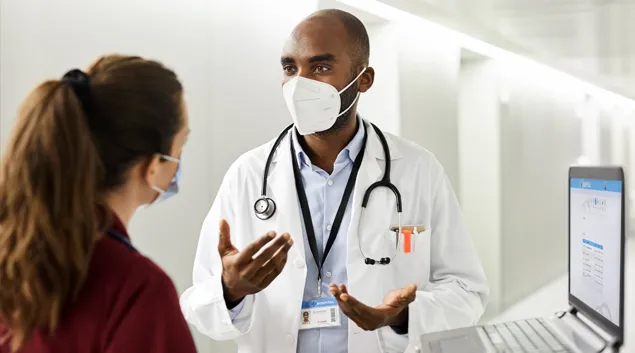 Doctor conferring with patient