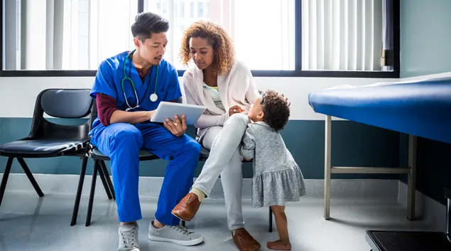 A medical visit with adult and child