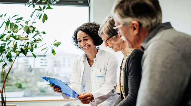 Smiling healthcare professional and couple