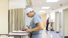 Doctor at desk in hallway