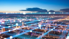 Image of interconnected systems as a grid in the air over city blocks