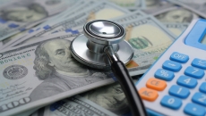 stethoscope, money and a calculator