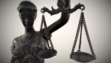 Miss Justice statue with scales