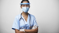 Person wearing stethoscope and mask