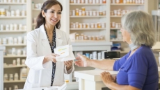 Pharmacist and consumer at counter