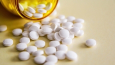 Pills spilling out of bottle