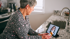 Senior attending telehealth appointment