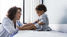 Doctor examining a child