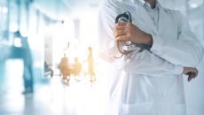 Person holding a stethoscope