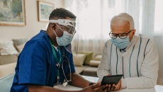 Home care visit with tablet