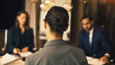 People at a conference table in discussion