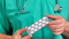 Person holds pill pack
