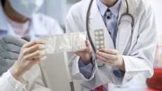 Pharmacists exchanging pills