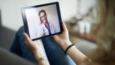 A telehealth consultation via handheld screen