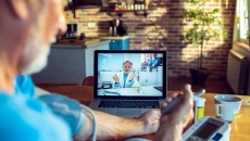 A telehealth visit via laptop