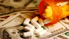 pills spilling onto money