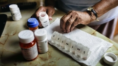Person sorting drugs