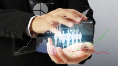 Businessman holding graphs