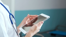 doctor holding tablet
