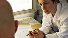 doctors talking over paperwork