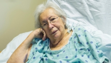 elderly woman in hospital bed