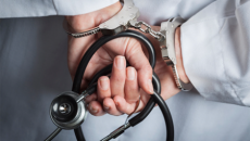 Handcuffs and stethoscope