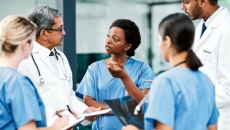 Clinicians talking in a hospital