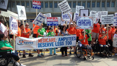 Amputees protest on Aug. 26 outside the Department of Health and Human Services.