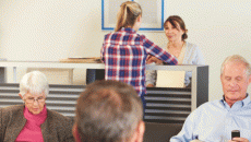 patients at reception desk