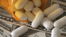 Prescription pills on top of money