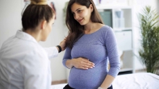 Pregnant woman with her doctor