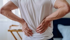 Man clutching his lower back