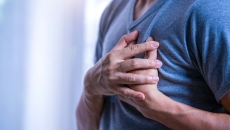 Person clutching their heart