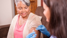 Patient getting a vaccine in their home