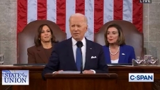 President Biden speaking, with V.P. Harris and Speaker Pelosi seated behind him. Photo: C-Span