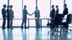 Execs shaking hands