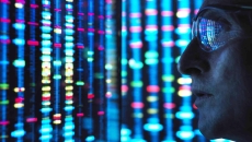 Scientist looking at DNA on a screen