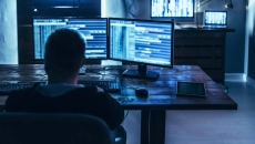 Person at computer in the dark